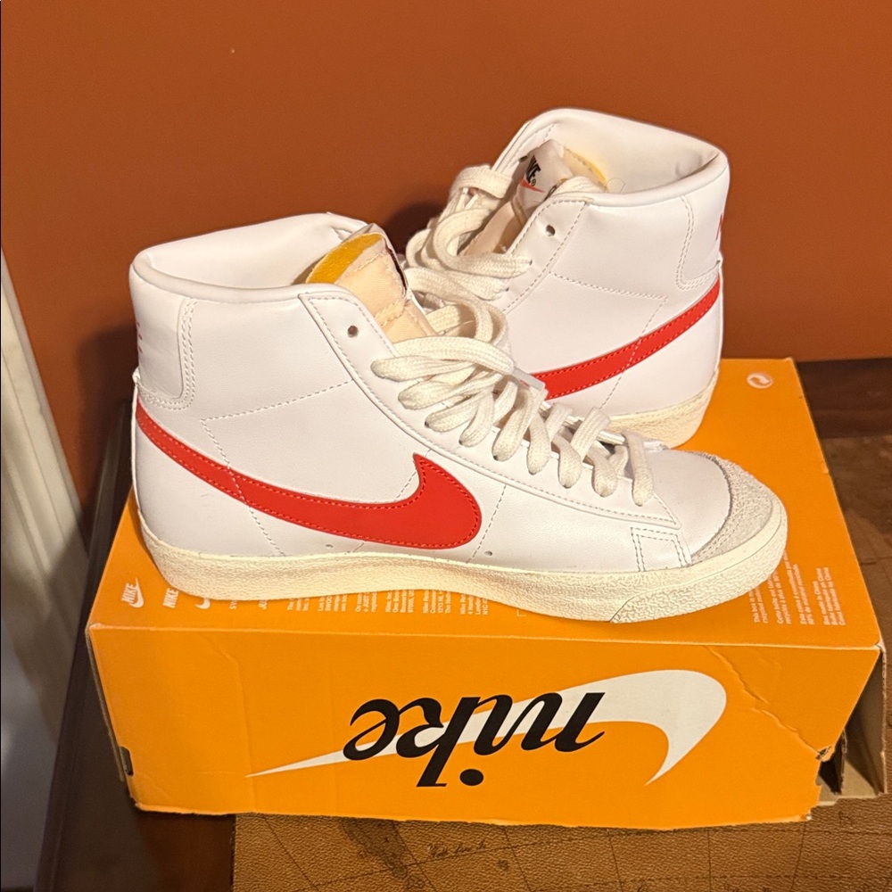 Nike Women’s White High-Top Sneakers with Red Swoosh Accent
